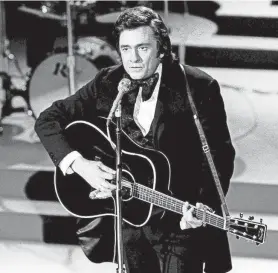  ?? JOE RUDIS/THE TENNESSEAN FILE ?? Johnny Cash performs during seventh annual CMA Awards on Oct. 15,1973.