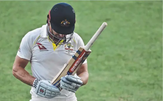  ??  ?? DOWN AND OUT: Australia's Shaun Marsh is dismissed by Pakistan's Mohammad Abbas during their Test match in Abu Dhabi yesterday.