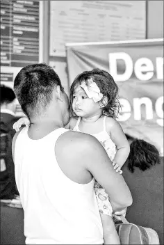  ??  ?? Patients arriving at the East Avenue Medical Centre in Manila.