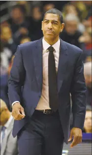  ?? Associated Press file photo ?? UConn head coach Kevin Ollie is seen here on the sidelines during a February game. Ollie and the Huskies were beaten by SMU in the first round of the AAC tournament on Thursday.