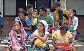  ?? PANNA GHOSH/AP ?? Refugees from India’s Manipur state rest at a relief camp at Lakhipur, Assam state, on Sunday. Security measures are keeping the peace in the neighborin­g state of Manipur, where 60 people were killed and 35,000 civilians were displaced in rioting and ethnic clashes last week, officials said.