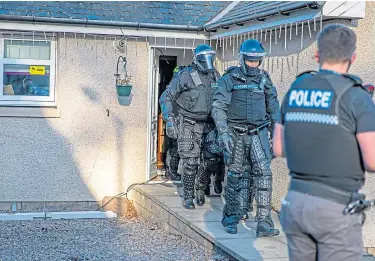  ??  ?? Police swooped on two properties in the operation targeting alleged human traffickin­g.