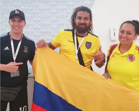  ?? ?? Argentina fan Damian (left) with Colombian siblings, Cristian (centre) and Paula. — photo by rituraj borkakoty