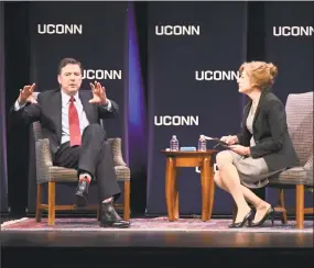  ?? John Woike / Hartford Courant via the Associated Press ?? Former Director of the FBI James Comey speaks at the Jorgensen Center for the Performing Arts on the UConn campus in Storrs on Monday. UConn President Susan Herbst, right, joined Comey for the second half of his speech.