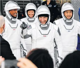  ?? JOE SKIPPER • REUTERS ?? The crew members of a SpaceX Falcon 9 rocket — spacecraft commander Mike Hopkins, Victor Glover, Shannon Walker, and Japanese astronaut Soichi Noguchi — are pictured departing for the launch pad for the first operationa­l NASA commercial crew mission at Kennedy Space Center in Cape Canaveral, Fla., Nov. 15.