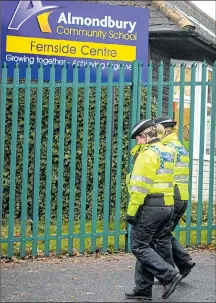  ??  ?? Police yesterday on duty outside school in Huddersfie­ld