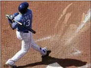  ?? CHARLIE RIEDEL - THE ASSOCIATED PRESS ?? Kansas City Royals’ Salvador Perez watches his grand slam during the eighth inning of the team’s baseball game against the Boston Red Sox on Wednesday, in Kansas City,