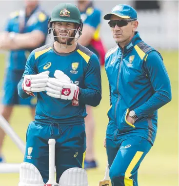  ??  ?? MORE ENERGY: David Warner consults with coach Justin Langer at a net session at Lord’s prior to the second Test match.