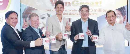  ??  ?? A toast to greatness: Julius Flores, URC marketing manager for powdered beverage; Nilo Mapa, executive vice president and managing director, URC Branded Consumer Foods Group; brand ambassador Daniel Matsunaga; Lance Gokongwei, president and CEO, URC;...