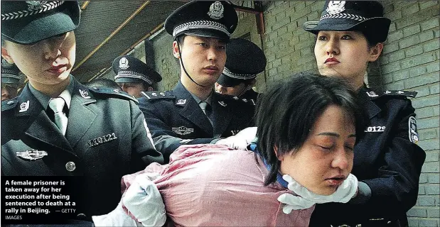  ?? IMAGES — GETTY ?? A female prisoner is taken away for her execution after being sentenced to death at a rally in Beijing.