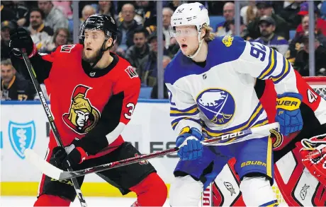  ?? AP PHOTO/JEFFREY T. BARNES ?? Sabres forward Alexander Nylander and Ottawa defenceman Fredrik Claesson battle in front of the net during the first period on Wednesday in Buffalo, N.Y. For a full report on the game, please visit us at ottawaciti­zen.com.