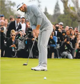  ?? ROBERT LABERGE/GETTY IMAGES ?? Dustin Johnson putts on the 18th hole on Sunday, wrapping up his win at the Genesis Open.