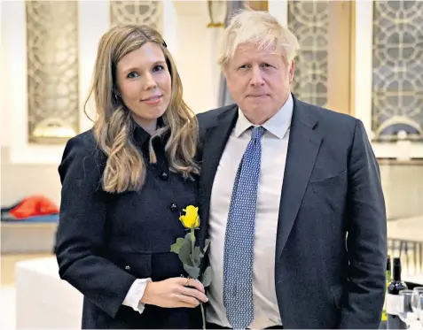  ?? ?? Carrie Johnson, with her husband Boris, the former prime minister, at the launch of a campaign in Westminste­r yesterday to block the release of Robert Brown