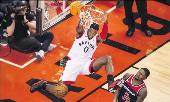  ?? PETER J THOMPSON ?? Toronto’s C.J. Miles slam dunks over Bradley Beal of the Washington Wizards during Game 2 of their NBA playoff series at Air Canada Centre on Tuesday night.