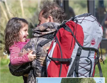  ??  ?? Joy as Poppy is hugged by dad Julian last night. Right, so near yet so far...his camper van exile
Pictures: ANDREW PRICE/VIEW FINDER PICTURES