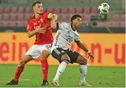  ??  ?? Switzerlan­d's Granit Xhaka (left) and Germany's Serge Gnabry vie for the ball during the Nations League match in Cologne, Germany, on Tuesday