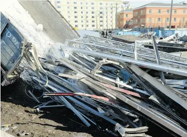  ?? Bruce Edwards/ Edmonton Journal ?? Scrap metal is unloaded Tuesday at Canadian Consolidat­ed Salvage Ltd. Metal thefts have been “escalating at an alarming rate,” says MLA Dave Quest, who introduced the private member’s bill.