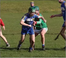  ??  ?? Colaiste Bhríde’s Sean Kehoe breaks free of his tackler.