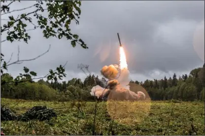  ?? The Associated Press ?? LANDMARK TREATY ENDS: This undated file photo provided Sept. 19, 2017, by Russian Defense Ministry official web site shows a Russian Iskander-K missile launched during a military exercise at a training ground at the Luzhsky Range, near St. Petersburg, Russia. A landmark arms control treaty that President Ronald Reagan and Soviet leader Mikhail Gorbachev signed three decades ago is dead. The U.S. and Russia both walked away from the deal on Friday.