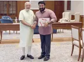  ??  ?? Malayalam actor Mohanlal during a meeting with PM Narendra Modi on Tuesday. There is speculatio­n that the actor may join the BJP soon.