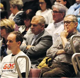  ?? JEAN LEVAC ?? SOS Vanier members gather at Ottawa City Hall on Wednesday for city council’s vote, which approved the Salvation Army plan for a shelter in Vanier.