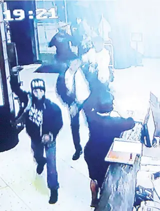  ??  ?? BRAZEN A CCTV footage shows the four armed men entering the Mabuhay Manor Hotel.