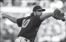  ?? JASON O. WATSON/GETTY IMAGES/TNS ?? Madison Bumgarner of the San Francisco Giants pitches against the Miami Marlins at Oracle Park on Sept. 14 in San Francisco.