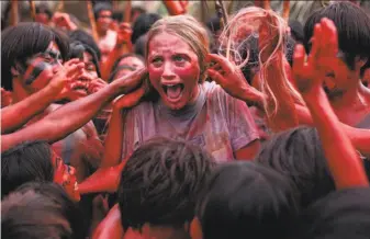  ?? Blumhouse Production­s ?? Ignacia Allamand in “The Green Inferno,” which starts out as a campus comedy giving protesters and political correctnes­s the snarky treatment and turns seriously gruesome.