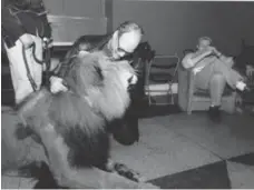  ??  ?? In November 2001, Bongo the lion gets a hug from Star columnist Rob Salem in the green room of Mike Bullard’s studio at the Masonic Temple.