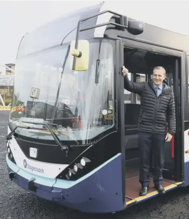  ??  ?? 0 Transport secretary Michael Matheson takes a trip on the new bus