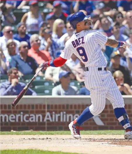  ?? | JONATHAN DANIEL/ GETTY IMAGES ?? Javy Baez ended a 1- for- 18 slide with a grand slam and an RBI single Thursday against the Reds.