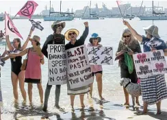  ?? Picture: Supplied ?? Cape Town residents protest on Long Beach in Simon’s Town yesterday against the navy’s planned detonation of underwater explosives.