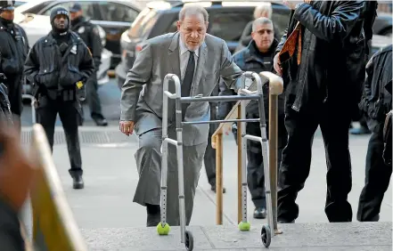  ?? AP ?? Harvey Weinstein arriving at court in New York this week, with his neon-balled walking frame.