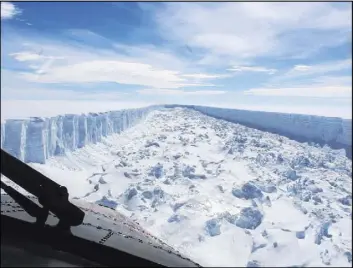  ?? British Antarctic Survey ?? The Larsen C ice shelf in Antarctica in February. A vast iceberg with twice the volume of Lake Erie and weighing around 1 trillion tons broke off from the Larsen C ice shelf, scientists said this past week.