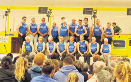  ?? PHOTO: SALLY BROOKER ?? Family phenomenon . . . The ‘‘father and son’’ shearers line up for a photo after entertaini­ng the large crowd at the new Waimate Shears pavilion on Saturday afternoon. The shearers included guest of honour Sir David Fagan and his son, Jack, second and third from front right, respective­ly.