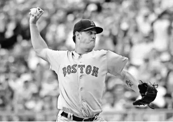  ?? PETER G. AIKEN, USA TODAY SPORTS ?? With eight wins and a 2.18 ERA entering Monday, Red Sox knucklebal­l pitcher Steven Wright has been a valuable pickup for many fantasy owners.