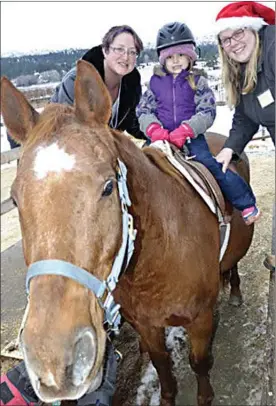  ?? Okanagan Weekend file photo ?? A youngster enjoys a ride on a mini-horse at the Arion Therapeuti­c Farm.