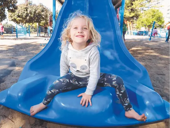  ?? Picture: RICHARD GOSLING ?? Four-year-old Emma Cordner plays at Burleigh Beach with her grandma Karen Williams ... the council is reviewing playground equipment.