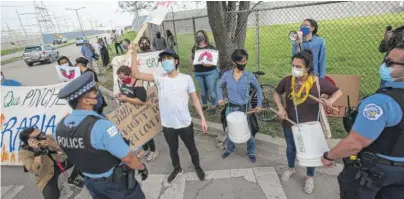  ?? JAMES FOSTER/SUN-TIMES ?? Protesters outside of the Crawford Power Plant in Little Village on Friday.