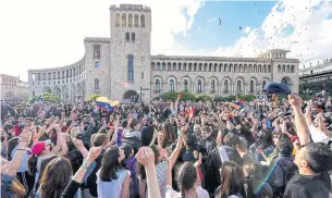  ?? AFP ?? People celebrate Armenian prime minister Serzh Sarkisian’s resignatio­n in downtown Yerevan on Monday. The veteran leader resigned after mass protests against his election as premier.