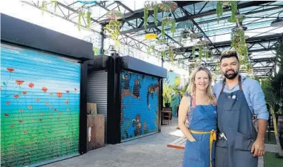  ?? CARLINE JEAN/SUN SENTINEL ?? Carlos Zuluaga and Sarah Price, owners of Shipyard in Hollywood, have converted a former alleyway and commercial parking area into a Wynwood Yard-style outdoor marketplac­e with five shipping-container restaurant­s, live music and murals.