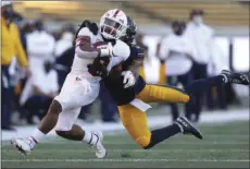  ?? AP PHOTO/JED JACOBSOHN ?? Stanford running back Nathaniel Peat carries as California safety Elijah Hicks defends during the second half of an NCAA college football game Friday in Berkeley, Calif.