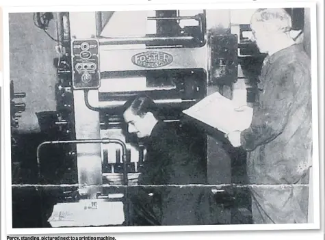  ??  ?? Percy, standing, pictured next to a printing machine.