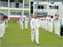  ??  ?? END OF THE ROAD: Border cricket stalwart Darryl Brown gets a round of applause from his teammates