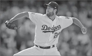  ?? Associated Press ?? Fewer fastballs: In this May 31, 2018, file photo, Los Angeles Dodgers starting pitcher Clayton Kershaw throws to a Philadelph­ia Phillies batter during the third inning of a baseball game in Los Angeles. Kershaw, Corey Kluber and Gerrit Cole are among the many big league pitchers maximizing success by throwing fewer fastballs.