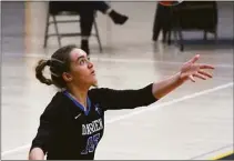  ?? Dave Stewart / Hearst Connecticu­t Media ?? Darien’s Leilani Gillespie gets set to serve against Trumbull during the CIAC Class LL girls volleyball final in East Haven on Nov. 19.