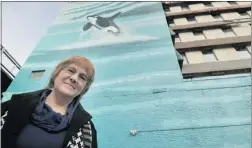  ?? WAYNE LEIDENFROS­T/ PNG ?? Jennifer Standeven, assistant director of business operations for the city, says the Old Continenta­l Hotel’s orca mural will be kept as a digital record.