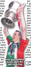  ??  ?? Prize guy: Halliday hoists aloft the 2001 Irish Cup