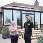  ??  ?? New conservato­ry Jason Lisett of Caledonian Windows with Tom McGhee of Ayr outside his new conservato­ry