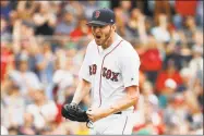  ?? Winslow Townson / Associated Press ?? Red Sox starting pitcher Chris Sale pumps his fist after striking out the Mariners’ Mike Zunino to end the seventh inning on Sunday.